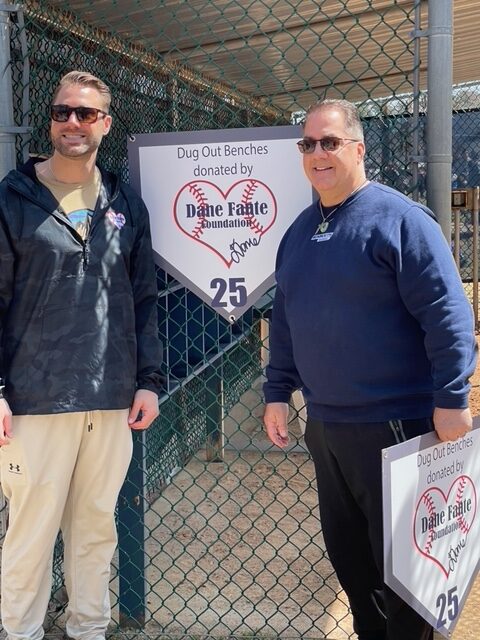 Dane Fantes Charity Placing Sign On Dugout