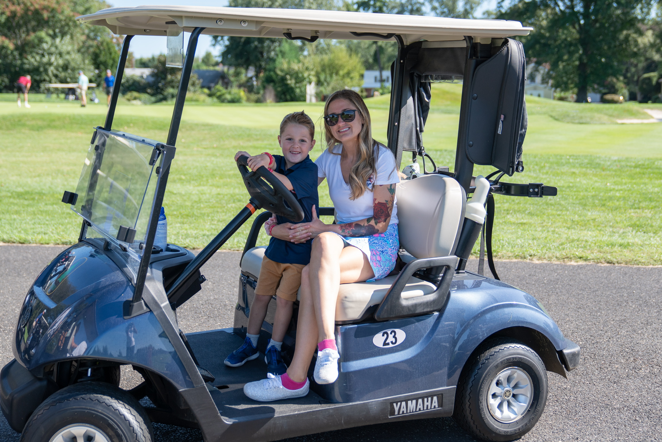 2021 Golf Outing Kid Riding In Golf Cart