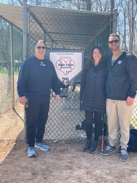 Dane Fante Foundation pic infront of Charity Sign for Dugout Donations