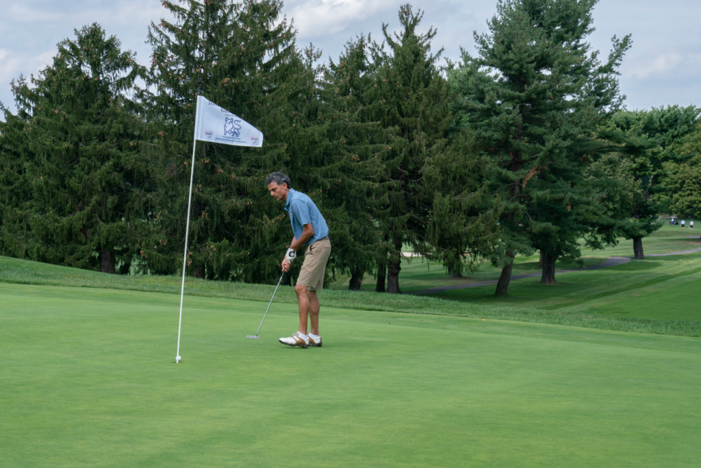 Dane Fante Golf Outing - Focused Player Sinking Put